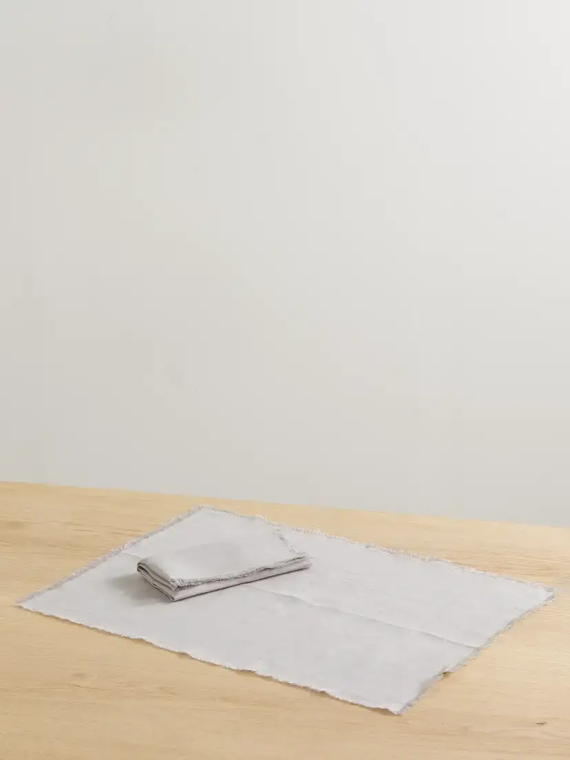 Brunello Cucinelli Frayed Linen Placemat And Napkin Set | Image 1 Brunello Cucinelli Frayed Linen Placemat And Napkin Set | Image 1