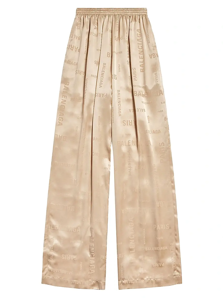 Balenciaga Women's Bal Paris Allover Fluid Tracksuit Pants - Light Beige | Image 1 Balenciaga Women's Bal Paris Allover Fluid Tracksuit Pants - Light Beige | Image 1