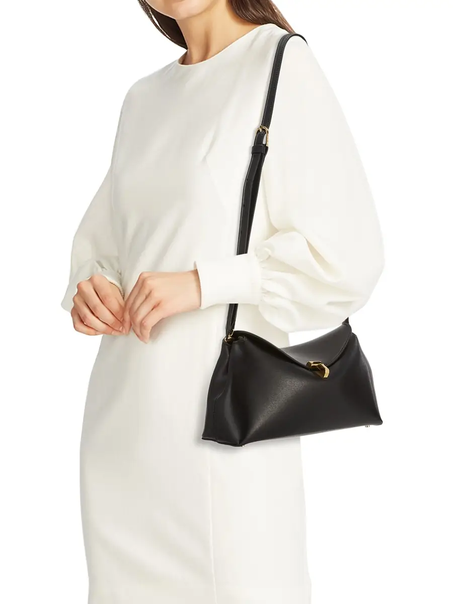 Toteme Women's T-Lock Convertible Leather Clutch - Black | Image 1 Toteme Women's T-Lock Convertible Leather Clutch - Black | Image 1