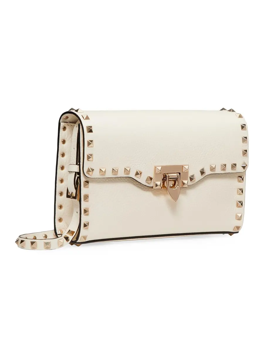 Valentino Garavani Women's Rockstud Grainy Calfskin Crossbody Bag - Light | Image 1 Valentino Garavani Women's Rockstud Grainy Calfskin Crossbody Bag - Light | Image 1