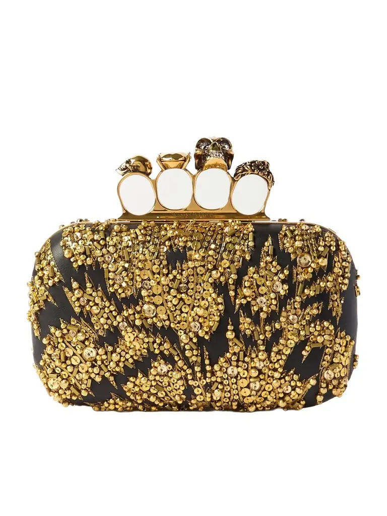 McQueen Skull Four Ring Embellished Leather Clutch | Image 1 McQueen Skull Four Ring Embellished Leather Clutch | Image 1