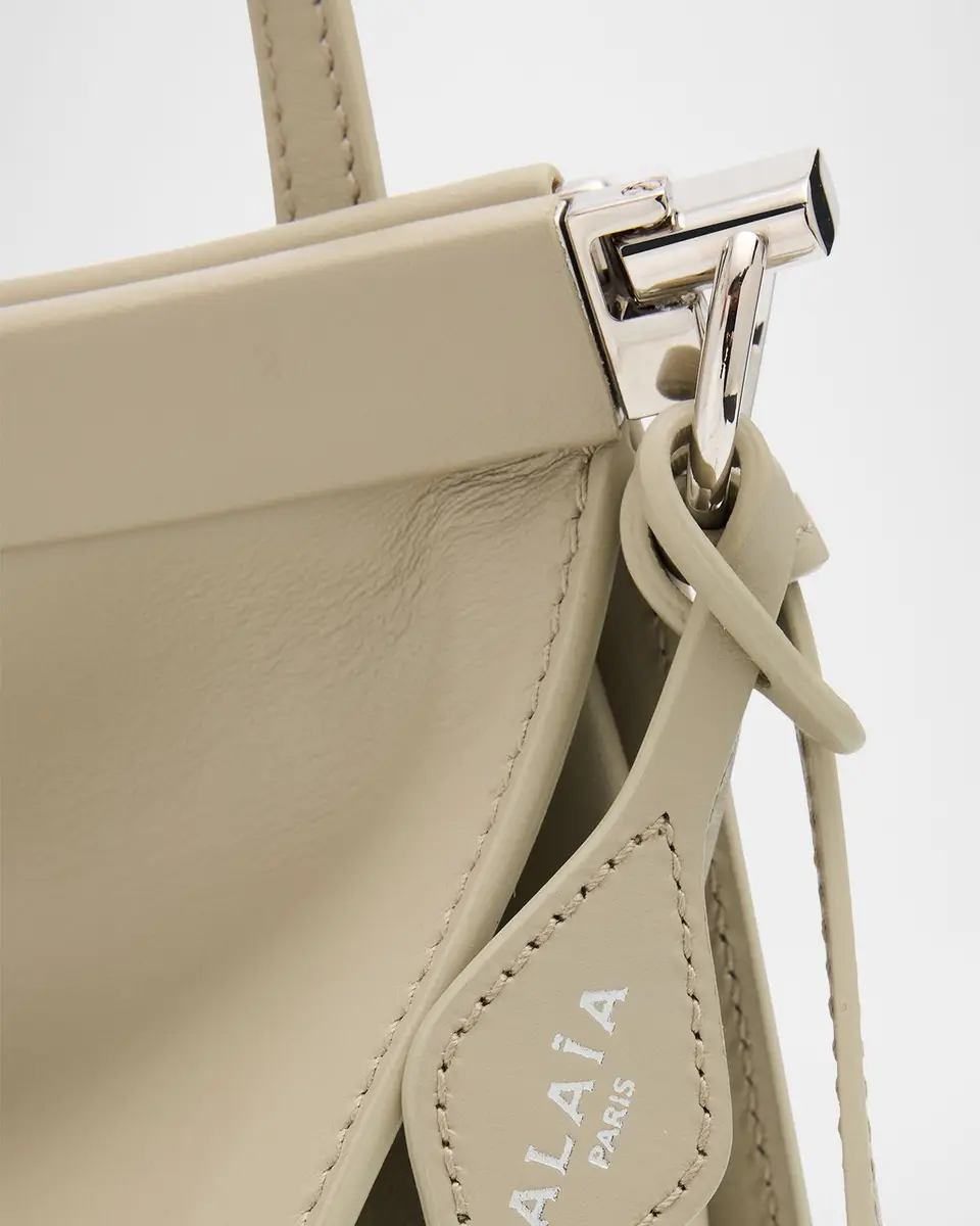 ALAÏA Le Click Medium Shoulder Bag in Glossy Leather | Thumbnail 37 ALAÏA Le Click Medium Shoulder Bag in Glossy Leather | Thumbnail 37