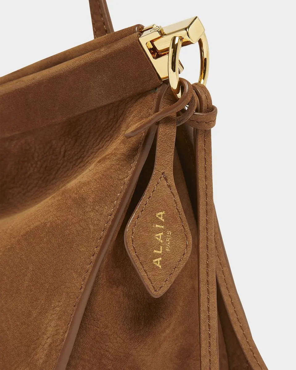 ALAÏA Le Click Medium Shoulder Bag in Suede | Thumbnail 42 ALAÏA Le Click Medium Shoulder Bag in Suede | Thumbnail 42