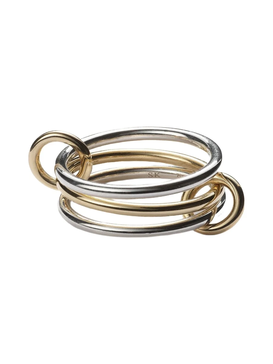 Solarium 18kt yellow gold and sterling silver linked rings Solarium 18kt yellow gold and sterling silver linked rings
