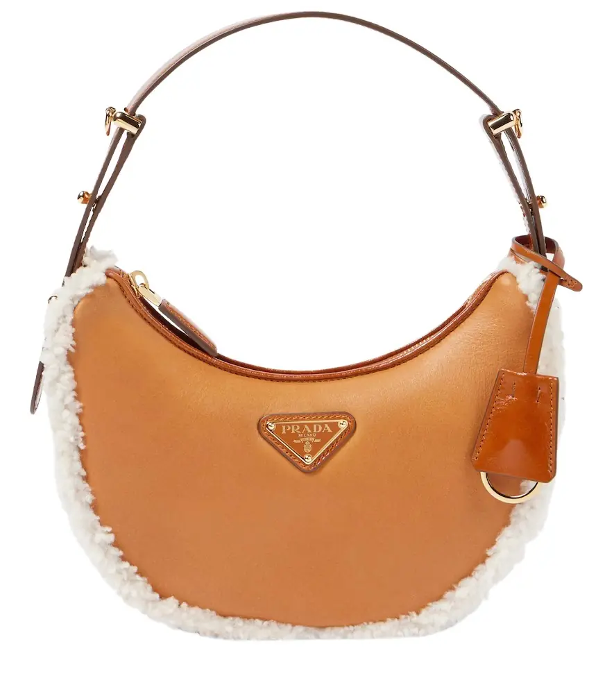 Prada Arqué Small shearling-trimmed shoulder bag | Image 1 Prada Arqué Small shearling-trimmed shoulder bag | Image 1