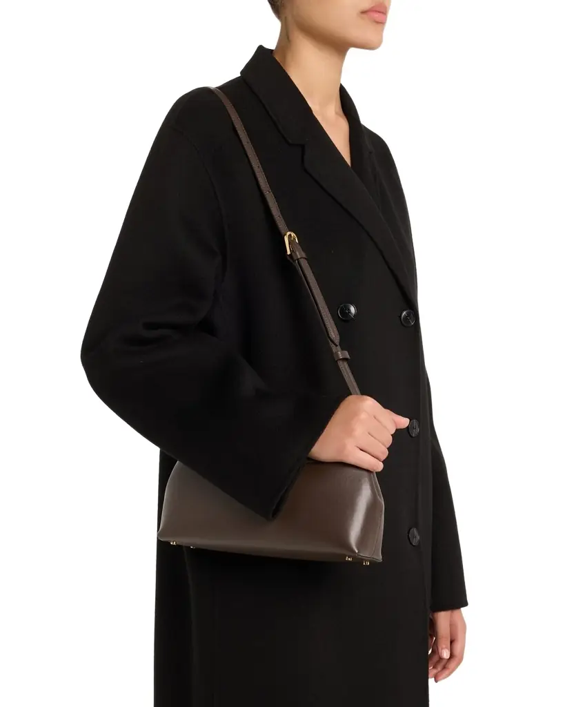 Toteme T Lock Flap Leather Clutch Bag | Image 1 Toteme T Lock Flap Leather Clutch Bag | Image 1