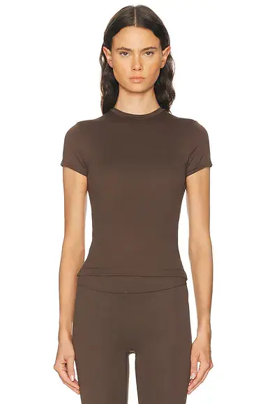 NikeSKIMS Matte Baby Short Sleeve Tee | Image 1 NikeSKIMS Matte Baby Short Sleeve Tee | Image 1