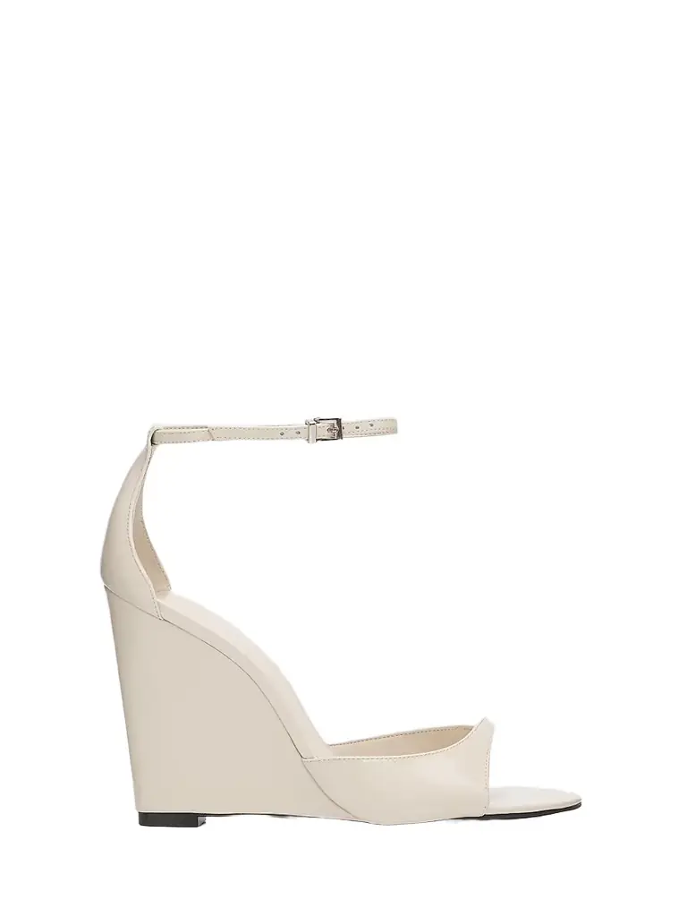 Schutz Women's Scarlett 100MM Patent Leather Wedge Sandals - Sugar White | Image 1 Schutz Women's Scarlett 100MM Patent Leather Wedge Sandals - Sugar White | Image 1
