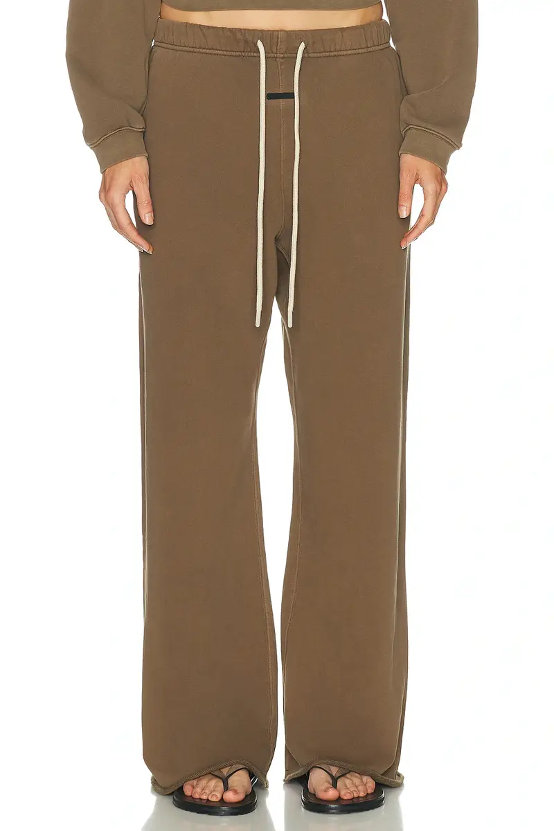 Fear of God ESSENTIALS Undone Cut Lounge Fit Sweatpant | Image 1 Fear of God ESSENTIALS Undone Cut Lounge Fit Sweatpant | Image 1