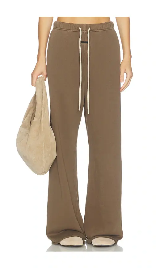 Fear of God ESSENTIALS Undone Cut Lounge Fit Sweatpant | Image 1 Fear of God ESSENTIALS Undone Cut Lounge Fit Sweatpant | Image 1