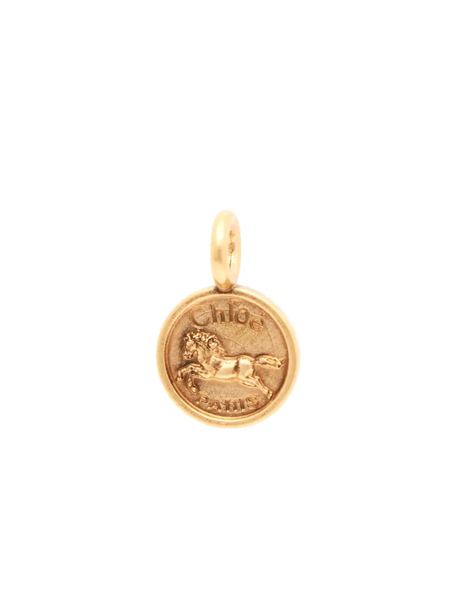 Chloé Alphabet Coin Horse charm in brass | Image 1 Chloé Alphabet Coin Horse charm in brass | Image 1