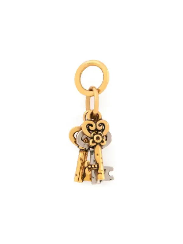 Key charm in brass Key charm in brass