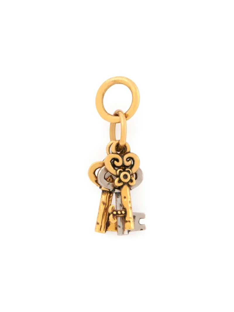 Key charm in brass Key charm in brass