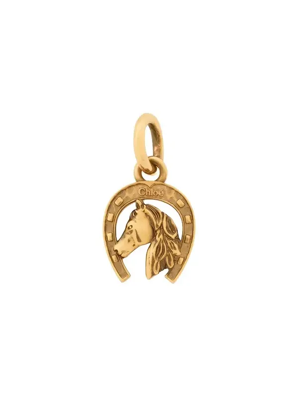 Horseshoe charm in brass Horseshoe charm in brass