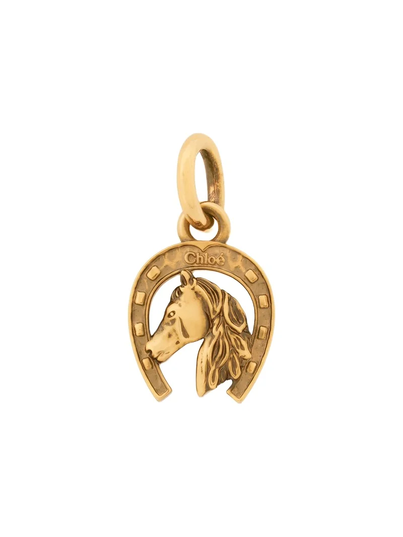 Horseshoe charm in brass Horseshoe charm in brass