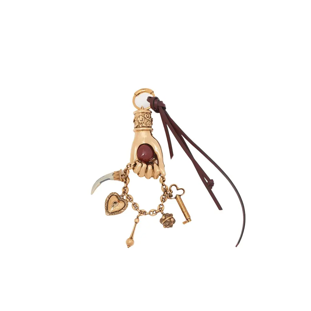Chloé Chloé Symbols Hand bag charm in brass | Image 1 Chloé Chloé Symbols Hand bag charm in brass | Image 1