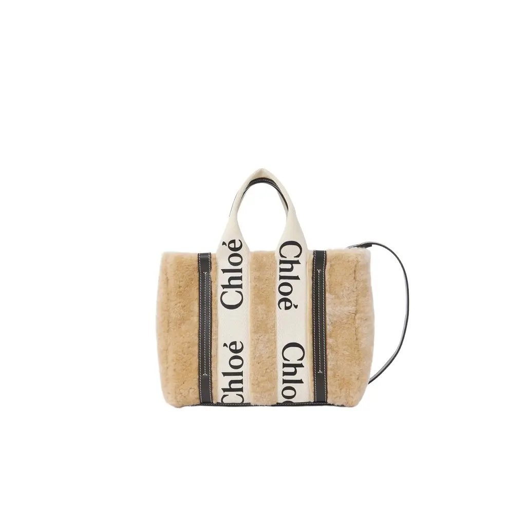 Chloé Small Woody tote bag in shearling | Image 1 Chloé Small Woody tote bag in shearling | Image 1