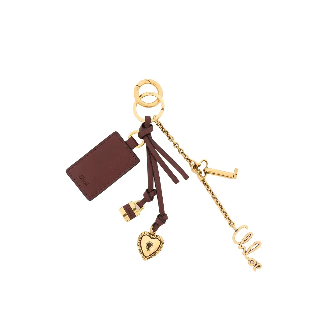 Chloé Chloé Symbols Heart & Lock key ring bag charm in brass & leather | Image 1 Chloé Chloé Symbols Heart & Lock key ring bag charm in brass & leather | Image 1