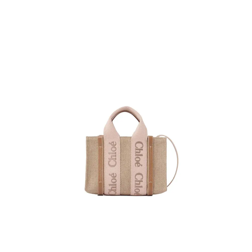 Chloé Mini Woody tote bag in linen | Image 1 Chloé Mini Woody tote bag in linen | Image 1