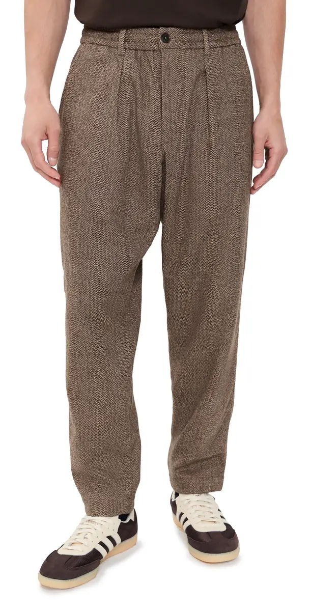 UNIVERSAL WORKS Wool Herringbone Pleated Track Pants Brown | Image 1 UNIVERSAL WORKS Wool Herringbone Pleated Track Pants Brown | Image 1