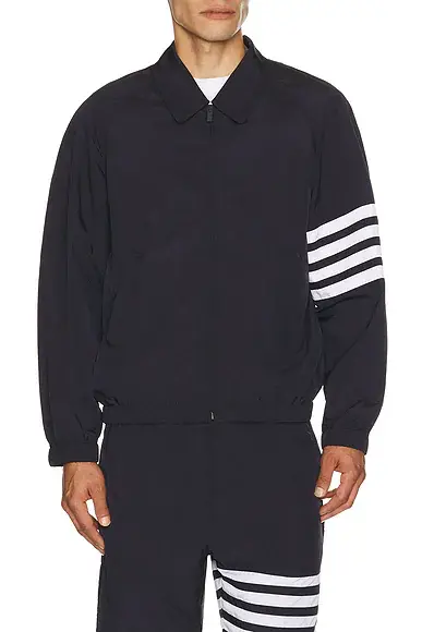 Thom Browne Zip Front Raglan Coach Jacket | Image 1 Thom Browne Zip Front Raglan Coach Jacket | Image 1