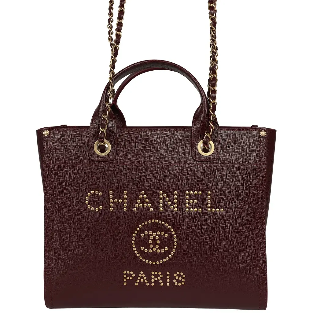 Chanel Chanel Small Studded Deauville Shopping Tote Burgundy Caviar Brushed Gold Hardware | Image 1 Chanel Chanel Small Studded Deauville Shopping Tote Burgundy Caviar Brushed Gold Hardware | Image 1