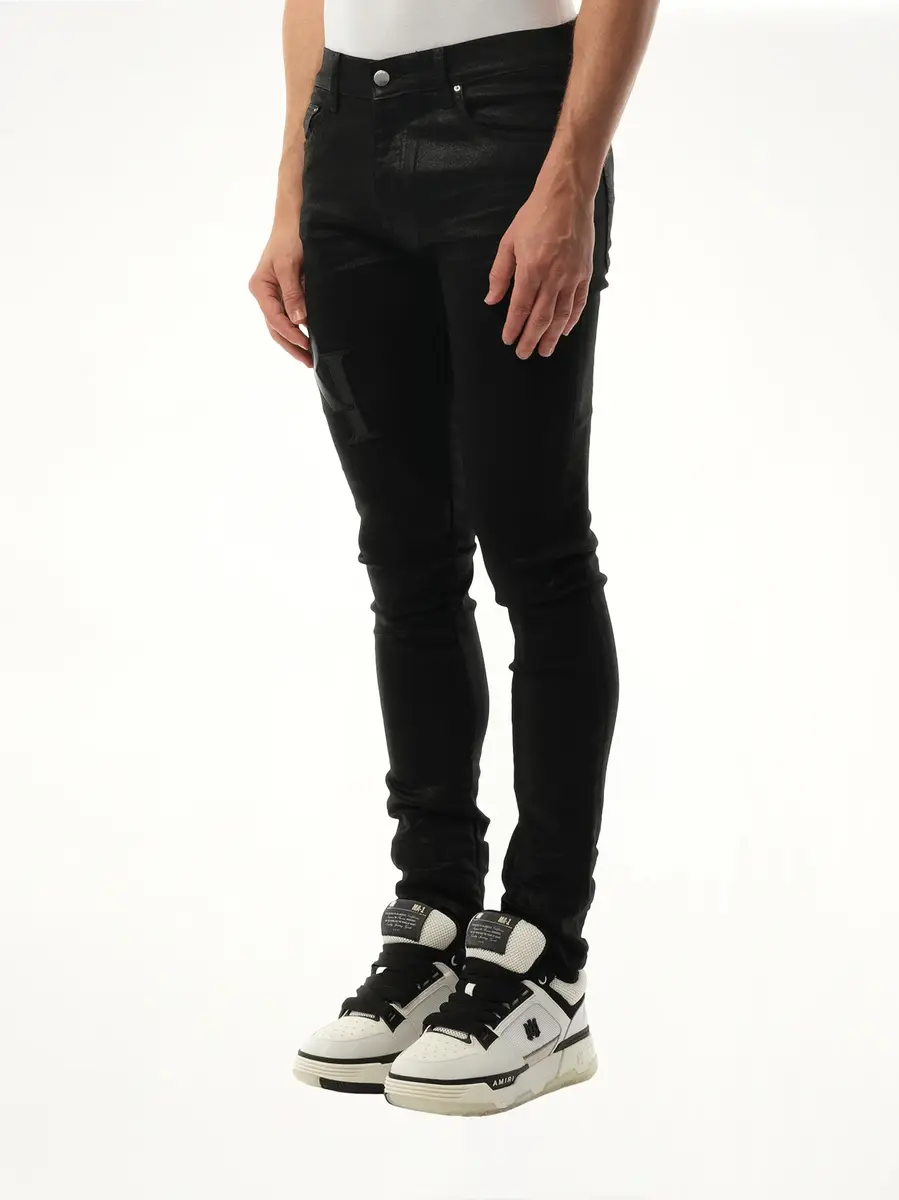 AMIRI Waxed Staggered Logo Skinny Jeans in Black Wax | Thumbnail 2 AMIRI Waxed Staggered Logo Skinny Jeans in Black Wax | Thumbnail 2