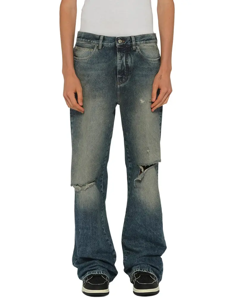 AMIRI Slashed Boot Cut Jean in Denim | Image 1 AMIRI Slashed Boot Cut Jean in Denim | Image 1