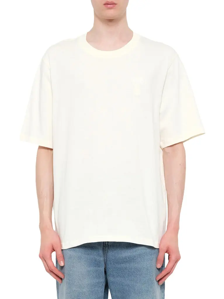 AMI PARIS Big Adc Embossed T-shirt in Cream White | Image 1 AMI PARIS Big Adc Embossed T-shirt in Cream White | Image 1