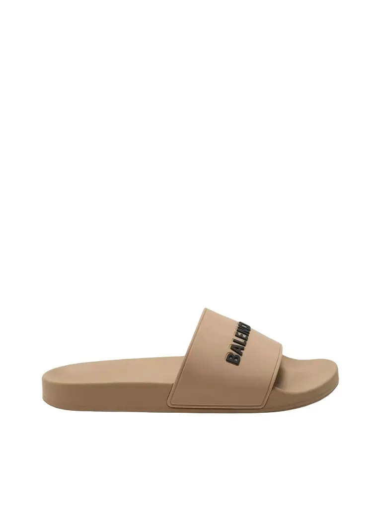 Balenciaga 3D Logo Rubber Pool Slide Sandal in Beige/black | Image 1 Balenciaga 3D Logo Rubber Pool Slide Sandal in Beige/black | Image 1