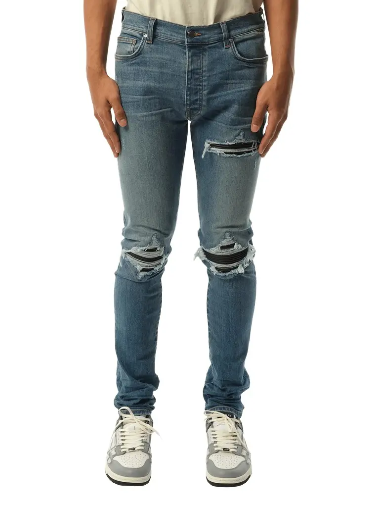 AMIRI Mx1 Distressed Jeans in Dark Indigo Blue | Image 1 AMIRI Mx1 Distressed Jeans in Dark Indigo Blue | Image 1