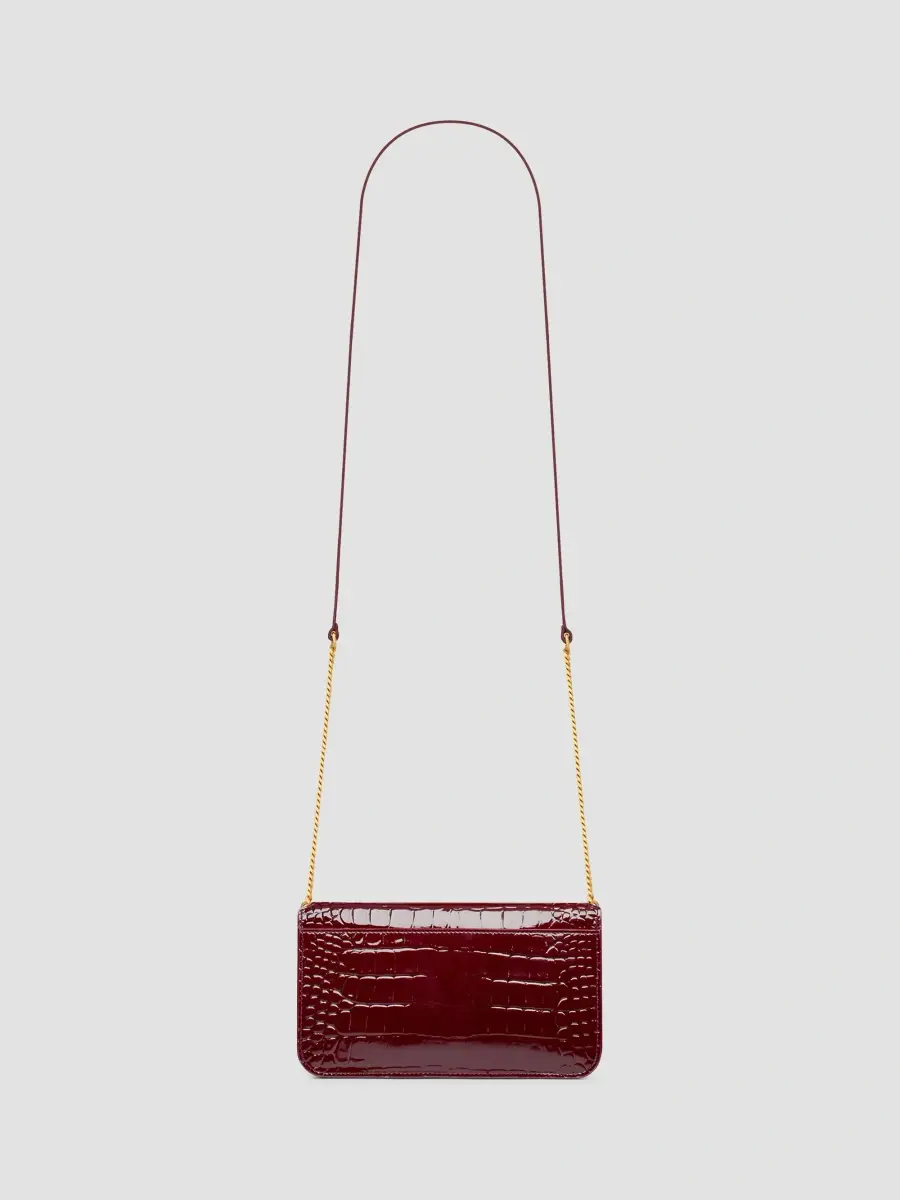 Saint Laurent Women's Cassandre Phone Holder in Crocodile-Embossed Patent Leather | Thumbnail 2