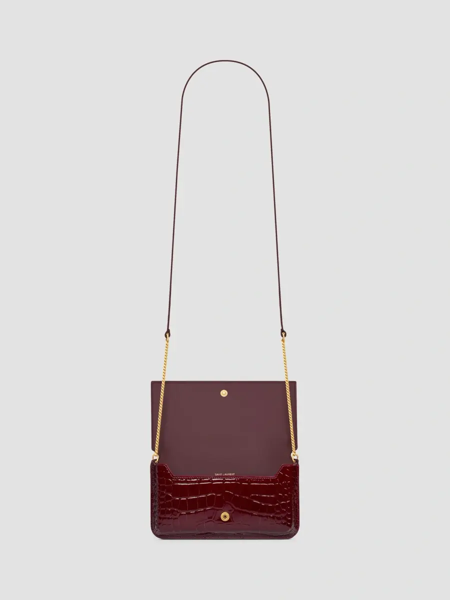 Saint Laurent Women's Cassandre Phone Holder in Crocodile-Embossed Patent Leather | Thumbnail 3