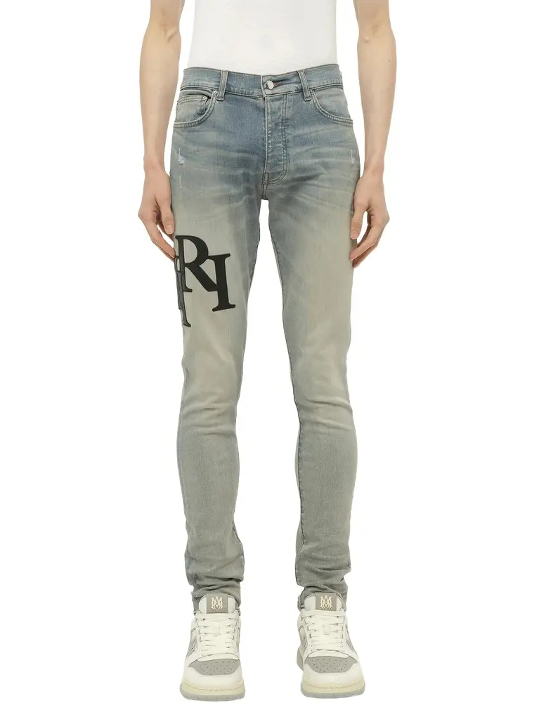 AMIRI Staggered Logo Skinny Jeans in Antique Indigo/black