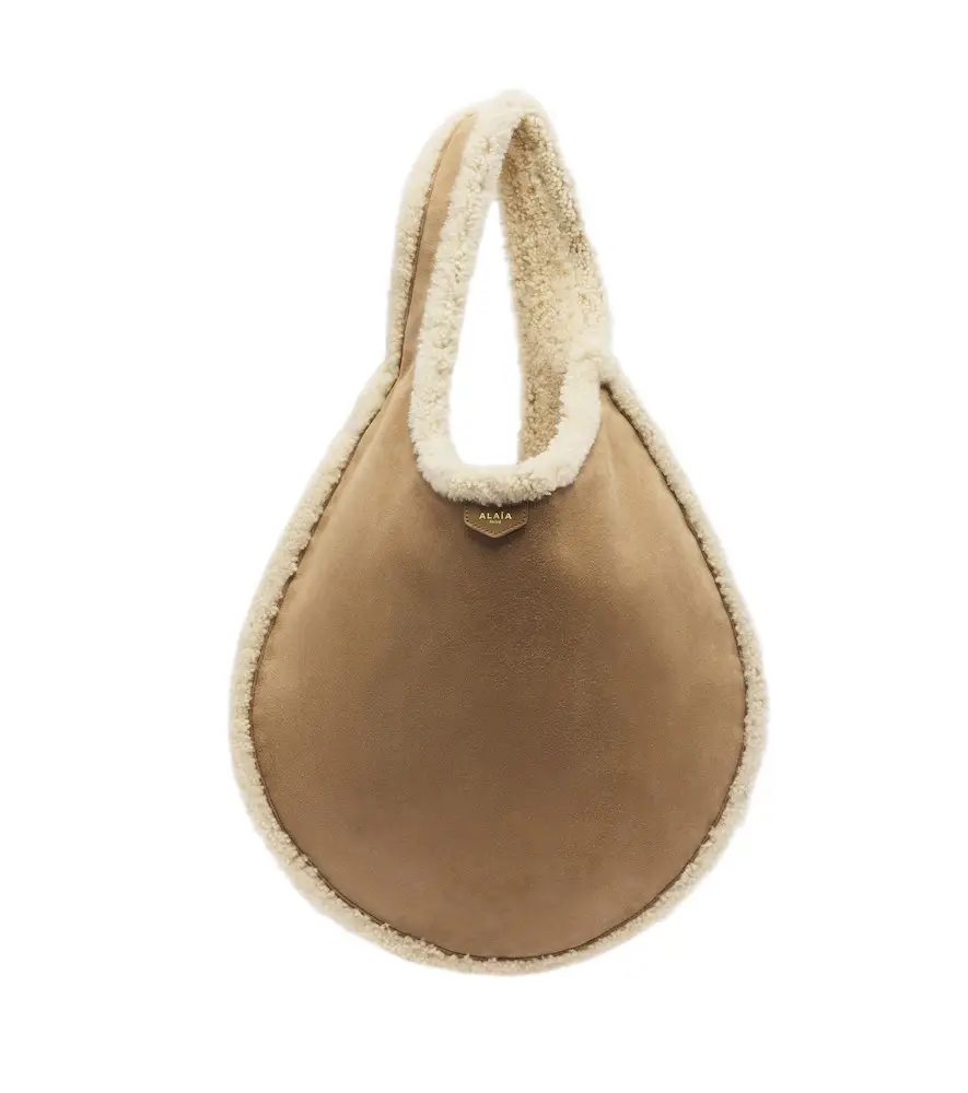 Alaïa Alaïa One Piece shearling-lined suede shoulder bag