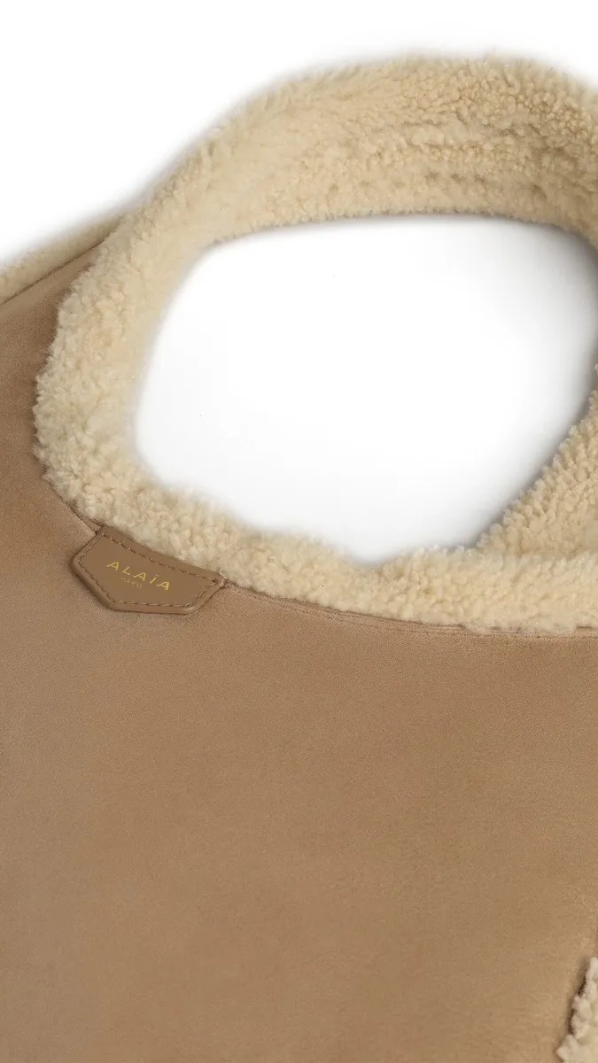 Alaïa One Piece Hobo Bag In Merino Shearling | Thumbnail 2 Alaïa One Piece Hobo Bag In Merino Shearling | Thumbnail 2