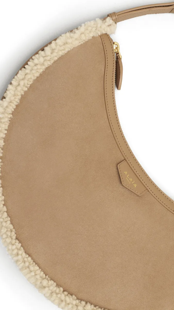 Alaïa One Piece Demi Lune Bag In Merino Shearling | Thumbnail 2 Alaïa One Piece Demi Lune Bag In Merino Shearling | Thumbnail 2